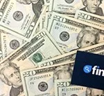 a pile of 20-dollar bills with finder.com logo