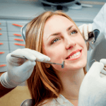 A woman smiling while a dentist is about to make a dental work