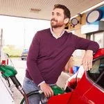 Young man at a gas station