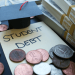 student debt paper with coins next to it