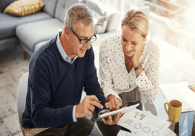 Couple reviewing finances on tablet