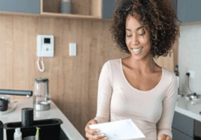 Woman looking at a financial paper