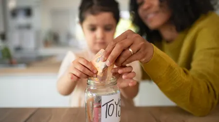 Little-multiracia-girl-saving-money_getty_supplied_450x250