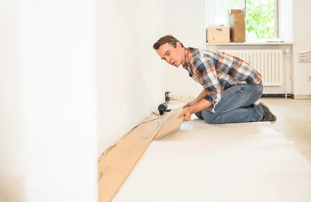 Man laying a new hardwood floor