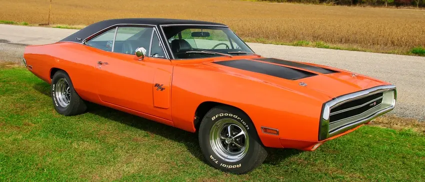 A classic orange Dodge Charger parked in a field Image: Pixabay