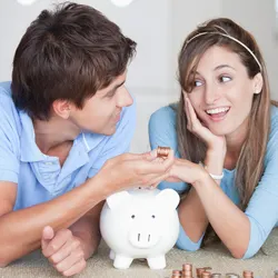 Young couple talking about their savings