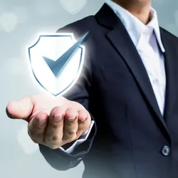 Abstract graphic of businessman holding a security check mark icon