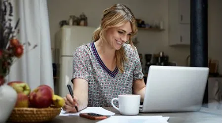 Woman baking on laptop
