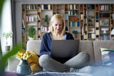 woman on her laptop on couch