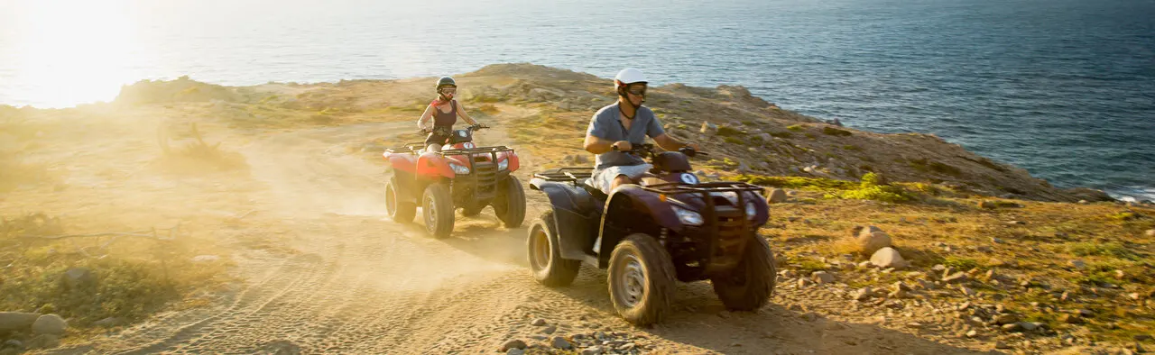 ATVing in the sun by ocean