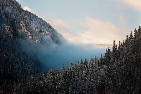 Low clouds by a mountain in BC