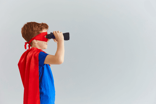 Kid superhero with binoculars