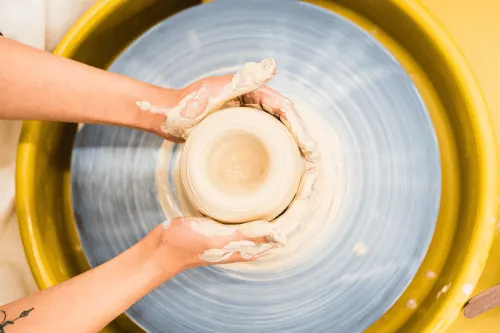 Hands doing pottery