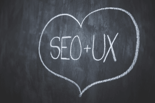 SEO and UX wrapped in a heart on a chalkboard